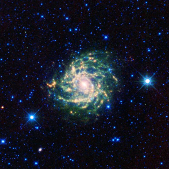 A spiral galaxy with stars in the background.