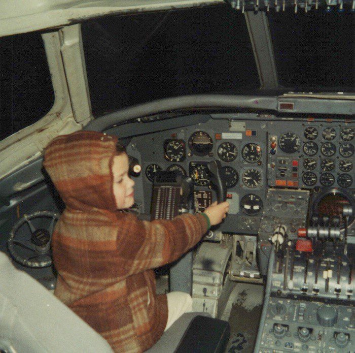 young pilot in cockpit