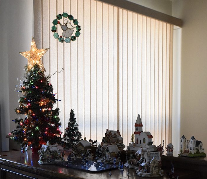 Christmas tree and toy houses placed on the table