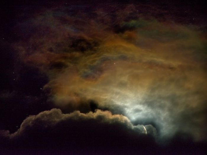 An image of a colorful cloud in the night sky.