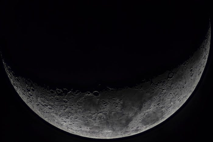 A close up of the moon with a black background.