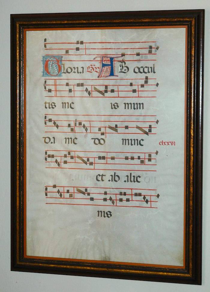 A frame with a piece of music on it.