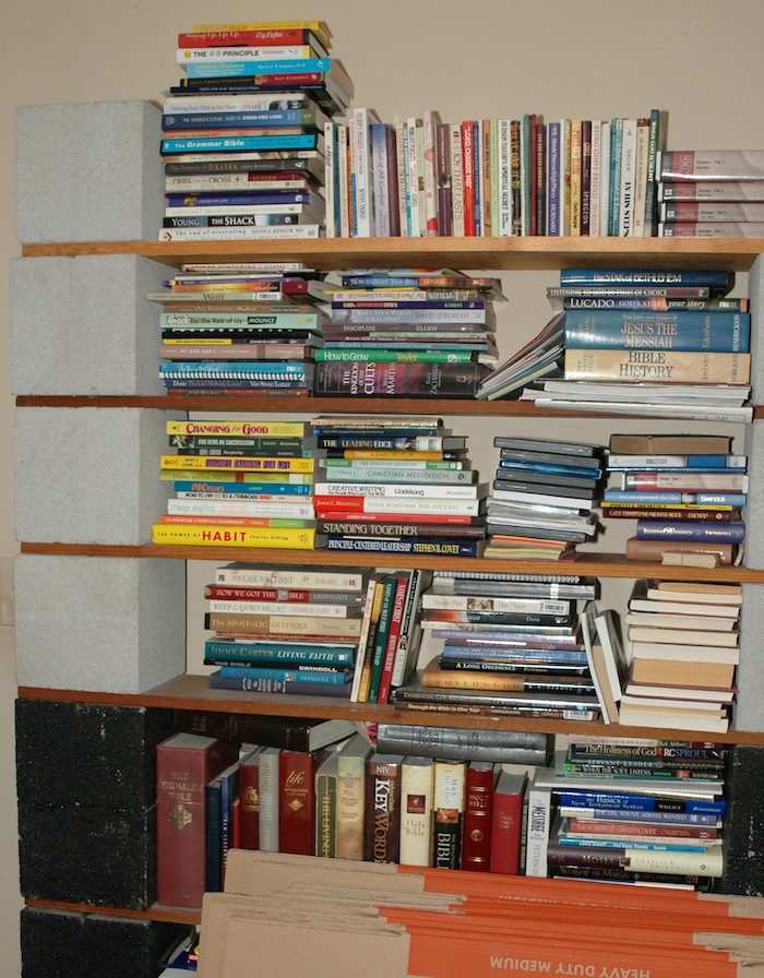 A stack of books on a shelf.