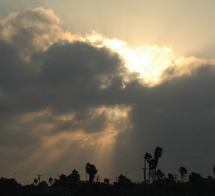 A sunbeam shines through a cloudy sky.