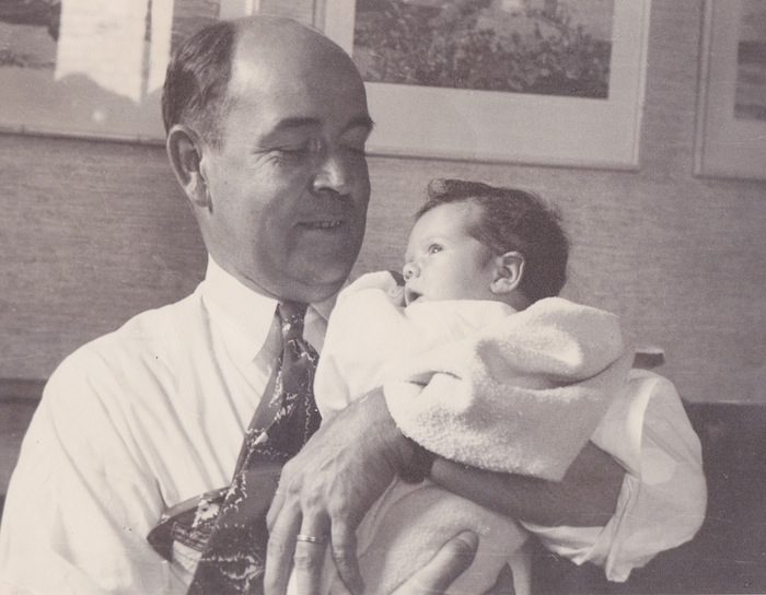 A man holding his child vintage photo