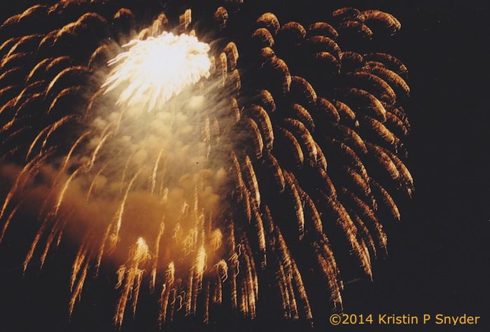 A large firework explodes in the sky.